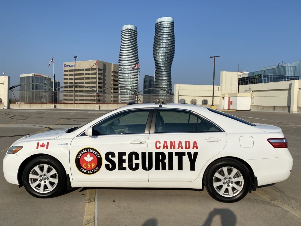 Canada Security Group patrol vehicle parked on a rooftop with Mississauga skyline in the background